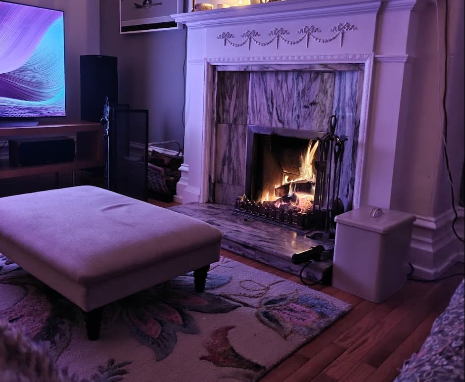 The open fire lit in the living room