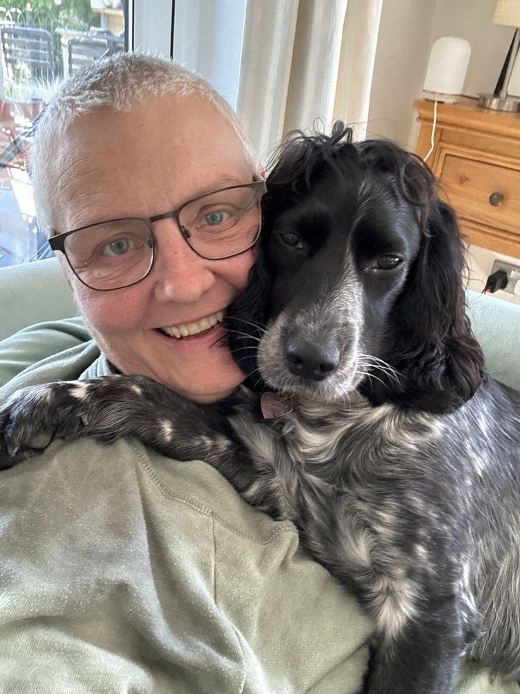 Michelle with a spaniel on a house sit